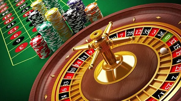 A professional live dealer interacting with players in an online blackjack setting, providing an authentic playtime experience